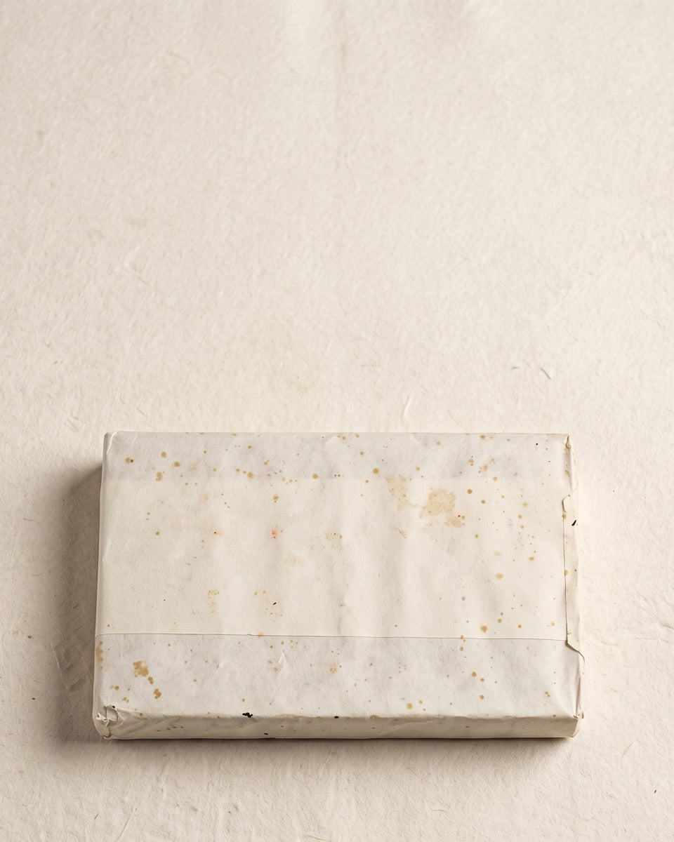 天甘 · 乔木生普 — 2013 Lincang raw puer brick, aged wrapper, on handmade paper